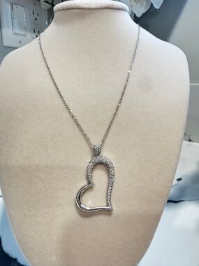 14 K white gold diamond heart necklace pendant with diamonds and chain.